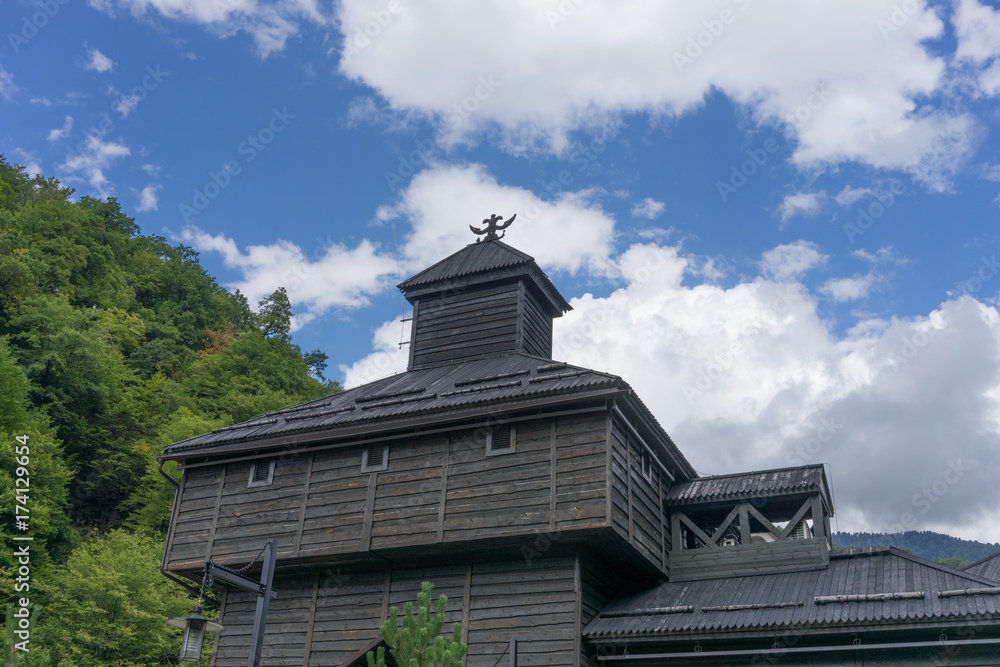 wooden building in the national color on the background of blue sky wooden building in the national color on the background of blue sky