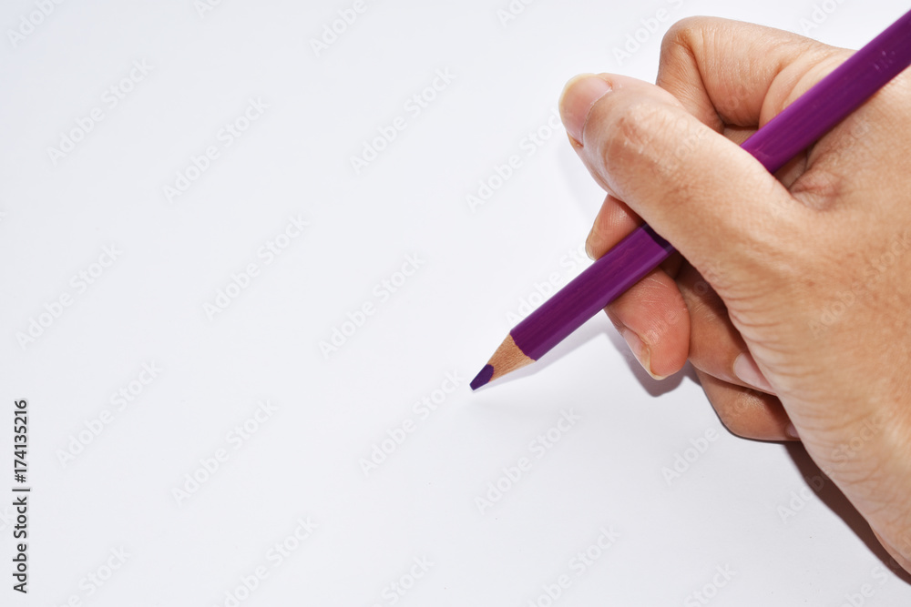 Hand holding color pencil Hand holding color pencil