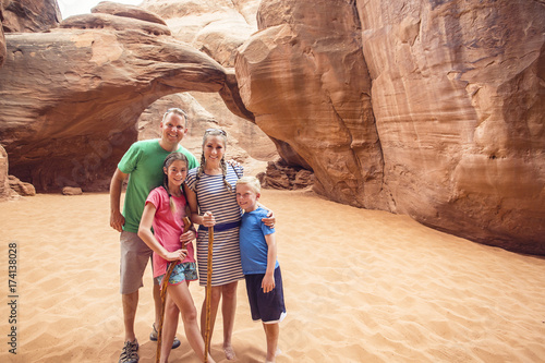 Family hiking and sightseeing together at Arches National Park 