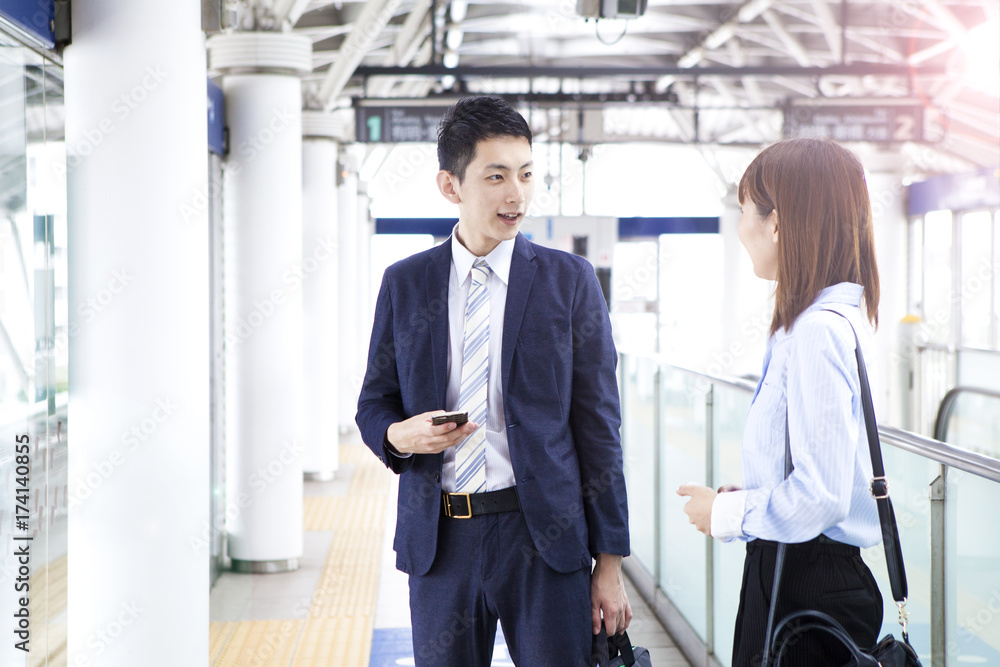 A business couple is talking at the station's home A business couple is talking at the station's home