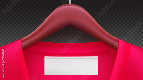 Wooden clothes hangers with red clothes, empty tag on the collar. Horizontal template on transparent background for advertising of sales or new arrivals. Place for your text on white tag on clothing.