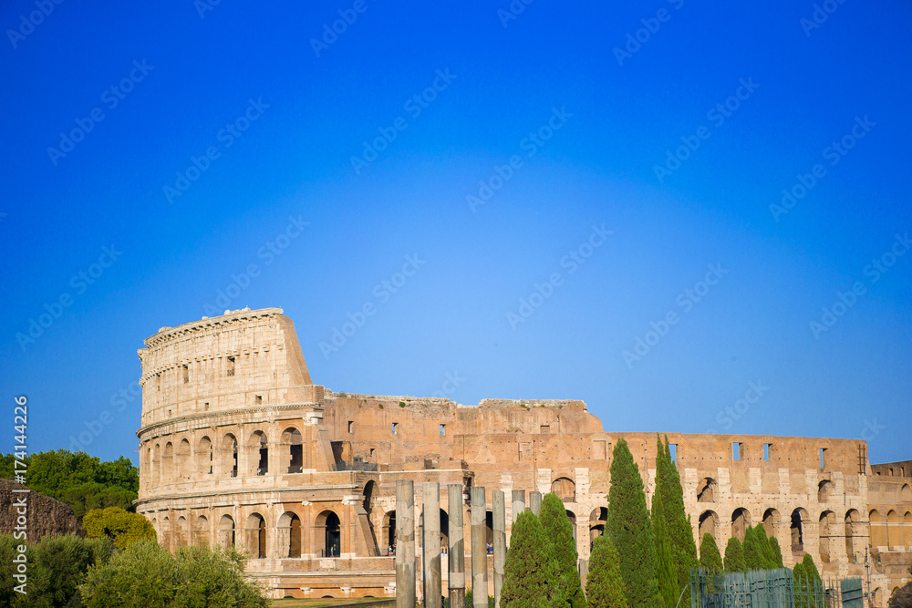 Colosseum or Coliseum background blue sky in Rome, Italy