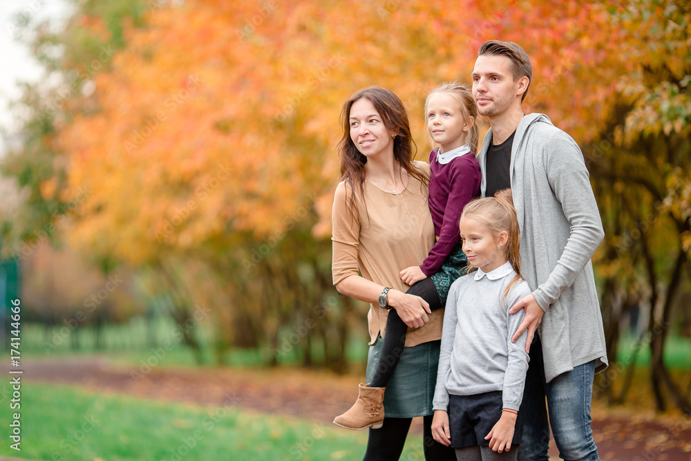 Portrait of happy family of four in autumn day Portrait of happy family of four in autumn day