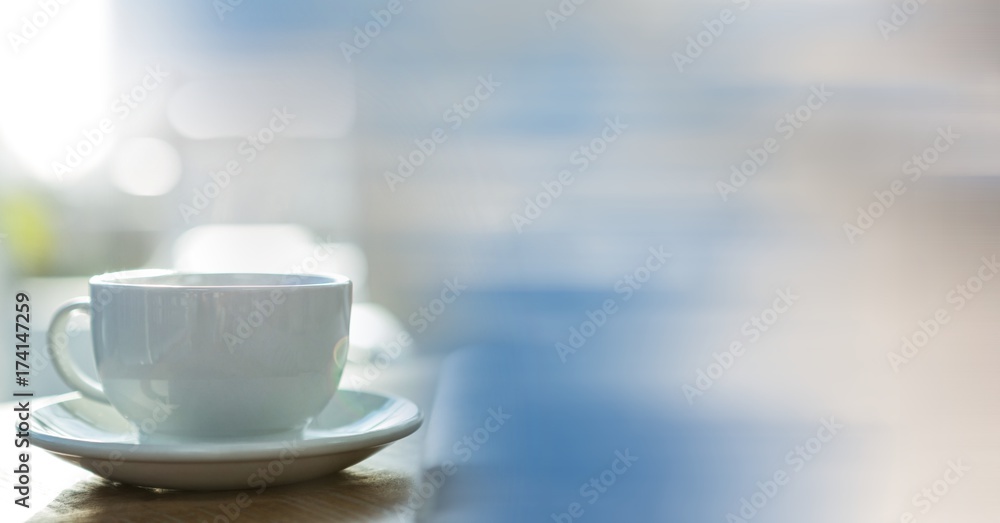 White coffee cup with blurry sky transition