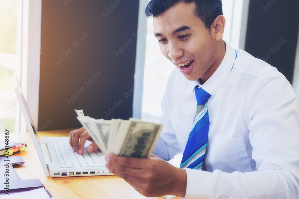 Young business people show joy after successful work. And get big bonuses. Young business people show joy after successful work. And get big bonuses.