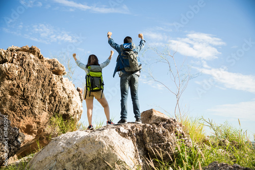 Proud couple on the mountaintop