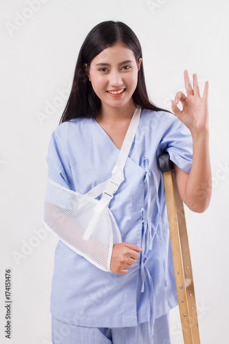 Slika na platnu injured woman patient pointing up ok hand gesture