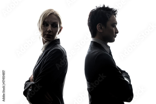 фотографія Silhouette of man and woman standing back to back.