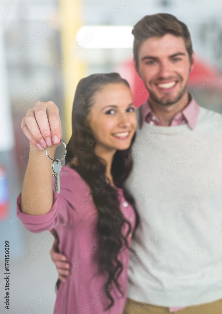 Fototapeta premium Couple Holding Keys with car