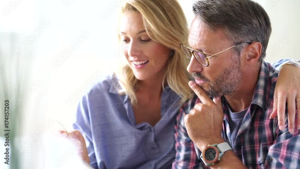 Mature couple buying on internet, online shopping Mature couple buying on internet, online shopping