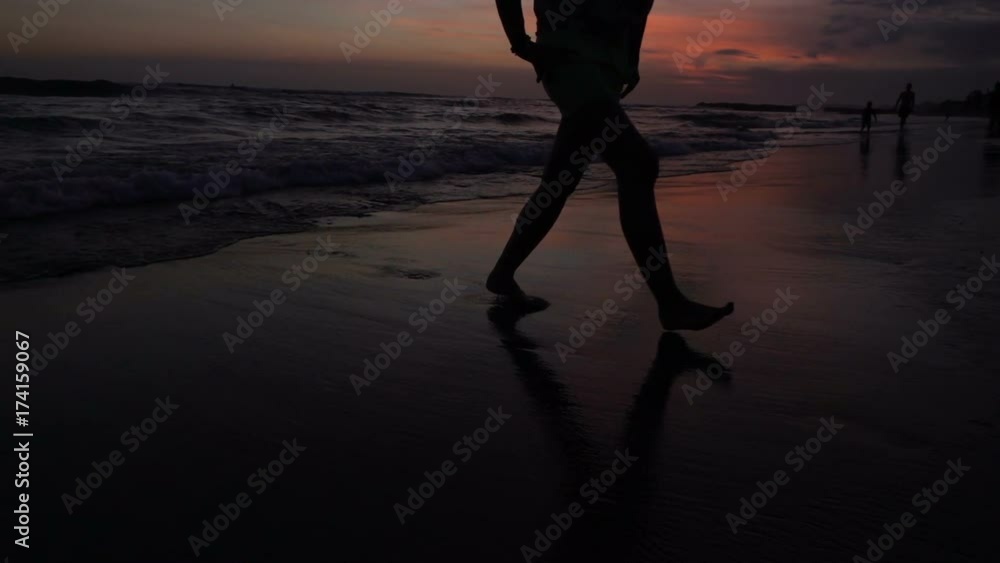 View of female's legs walking on the sandy beach, slow motion shot at 240fps, steadycam shot
View of female's legs walking on the sandy beach, slow motion shot at 240fps, steadycam shot