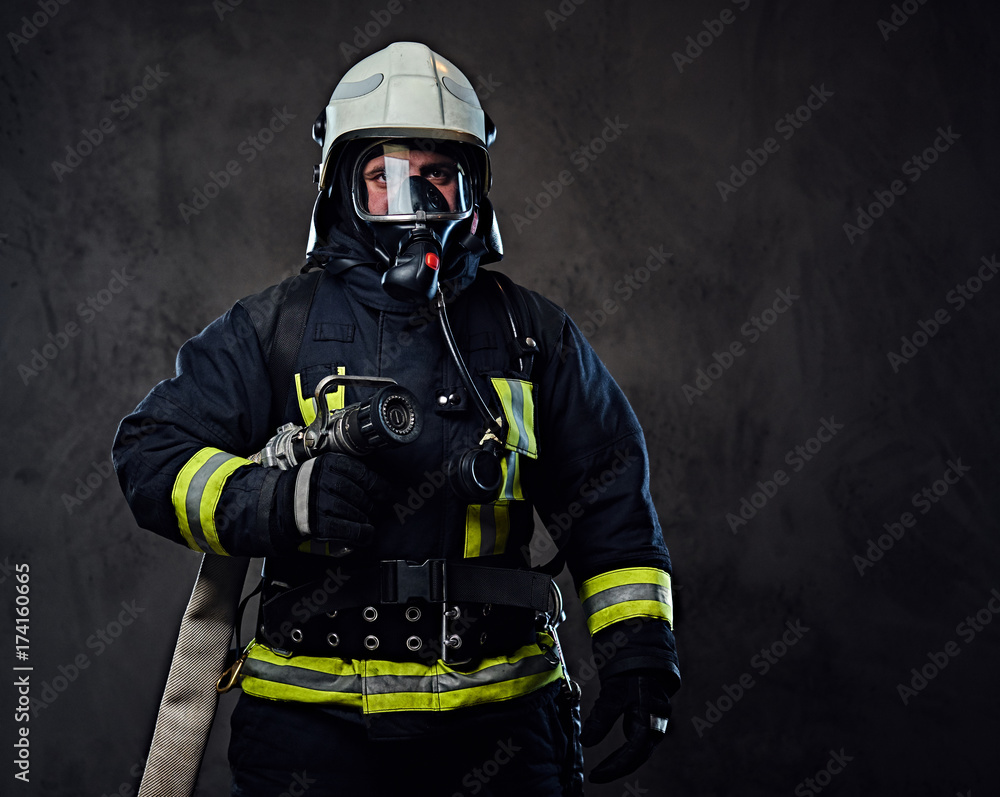 Fototapeta premium Firefighter dressed in uniform and an oxygen mask.