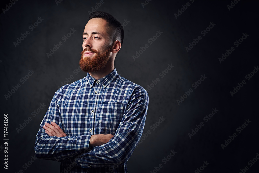 A man with crossed arms, dressed in a blue fleece shirt. A man with crossed arms, dressed in a blue fleece shirt.