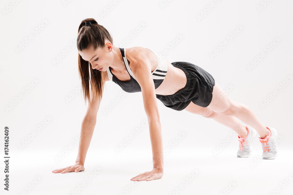 Fototapeta premium Portrait of a concentrated fitness woman