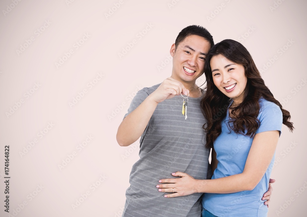 Couple Holding key in front of vignette Couple Holding key in front of vignette