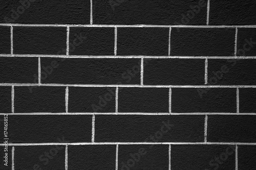 Background black and white brick wall. Architectural element - a dark design of the structure. The texture of the ceiling.