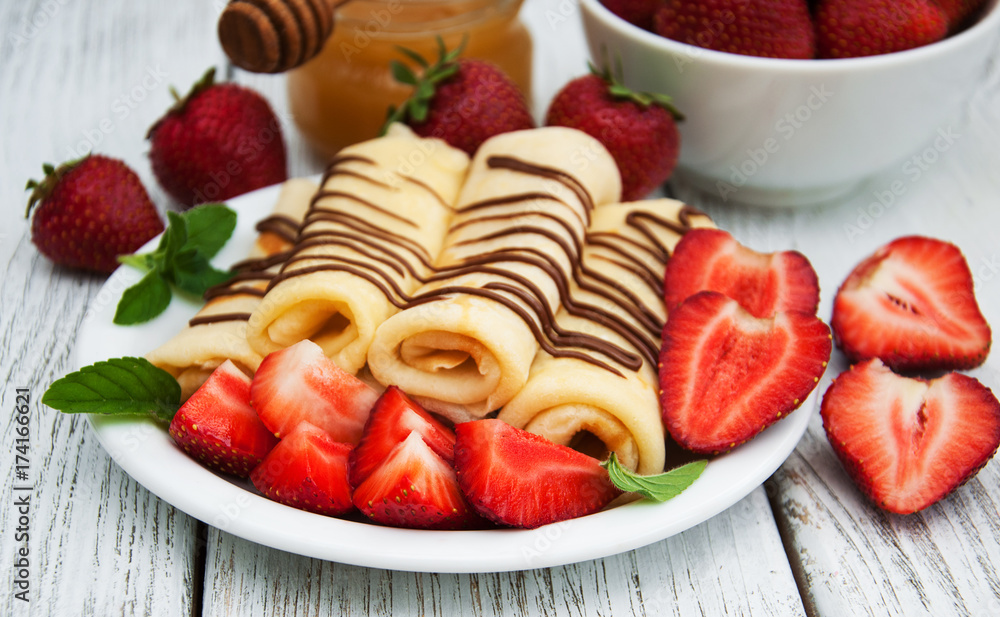crepes with strawberries and chocolate sauce crepes with strawberries and chocolate sauce