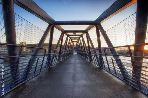 The Trafalgar Bridge is a pedestrian and cycle bridge located at the barrage crossing over the barrage lock on the river Tawe, Swansea, South Wales, UK