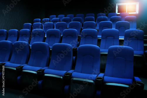 empty new blue seats in auditorium or movie theater