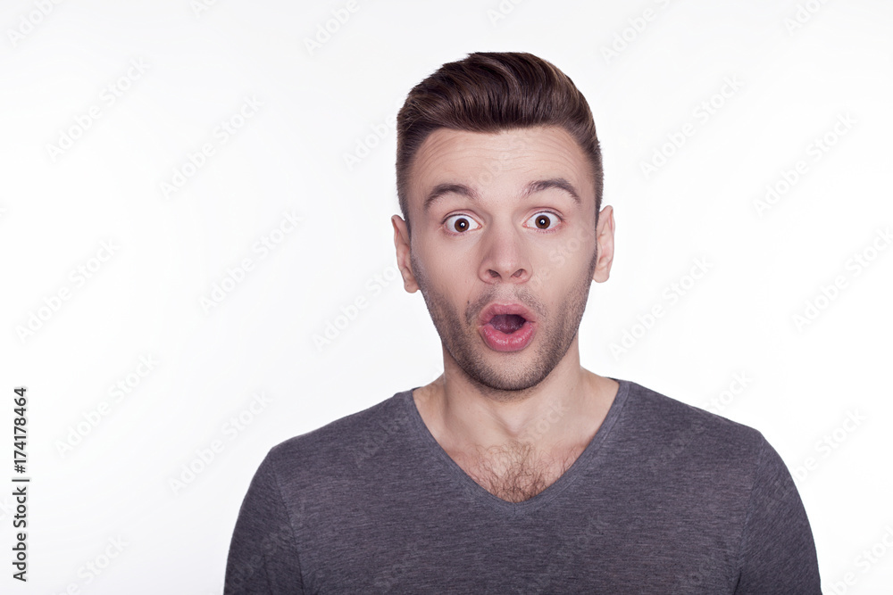 Portrait of shocked young man with opened mouth isolated on white background. Portrait of shocked young man with opened mouth isolated on white background.