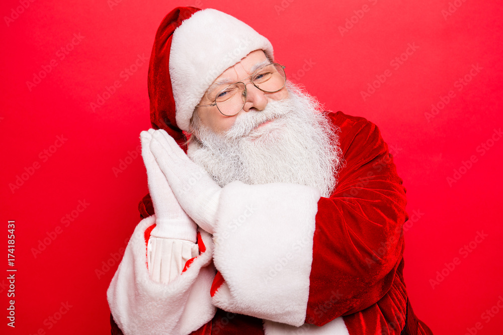 Bedding, festive, magic, nap, snooze, rest time. Holly jolly x mas! Funny cheerful saint nicholas in traditional head wear shows go to bed gesture with arms, isolated on red background Bedding, festive, magic, nap, snooze, rest time. Holly jolly x mas! Funny cheerful saint nicholas in traditional head wear shows go to bed gesture with arms, isolated on red background