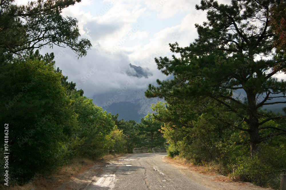 Fototapeta premium Mountain in dense fog and clouds