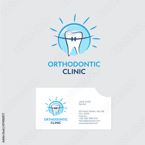 Orthodontist clinic logo. A tooth with braces in blue shine. Business card with a bite of even teeth