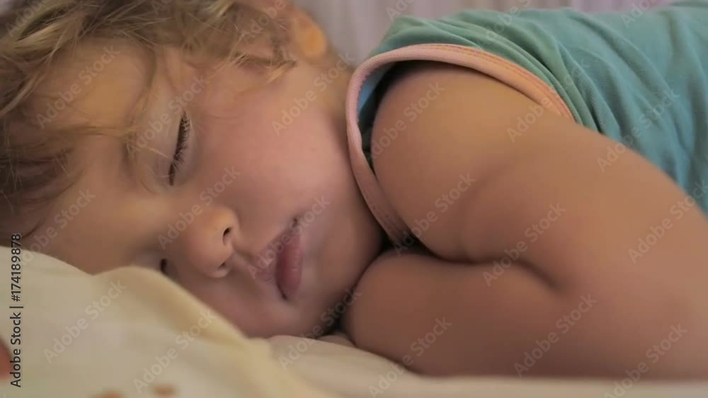 Newborn cute baby sleeping. Close Up portrait, caucasian child. Adorable little boy sleeping in a bed. Newborn cute baby sleeping. Close Up portrait, caucasian child. Adorable little boy sleeping in a bed.