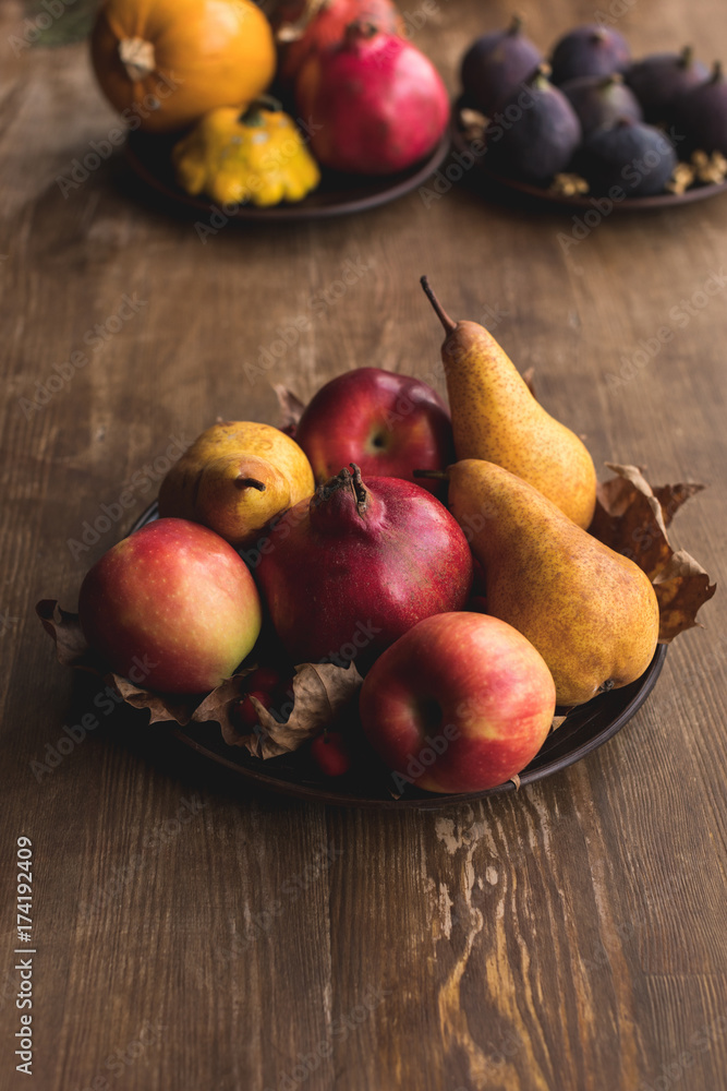 ripe autumn fruits on table