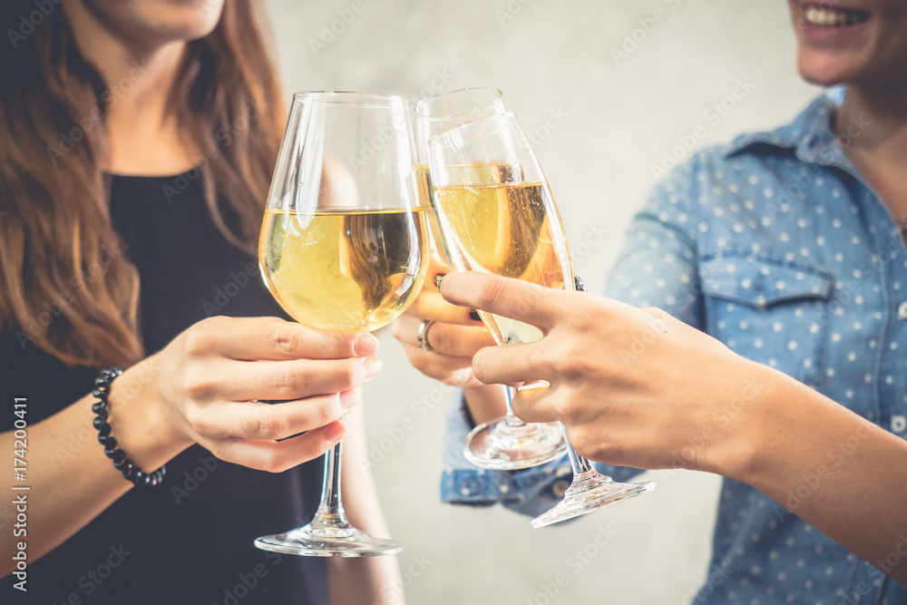 Group of women celebrating in a party, clinking glasses of wine,beer,liquor, spirit, booze with happy and relaxing feeling, party and celebration concept vintage tone Group of women celebrating in a party, clinking glasses of wine,beer,liquor, spirit, booze with happy and relaxing feeling, party and celebration concept vintage tone