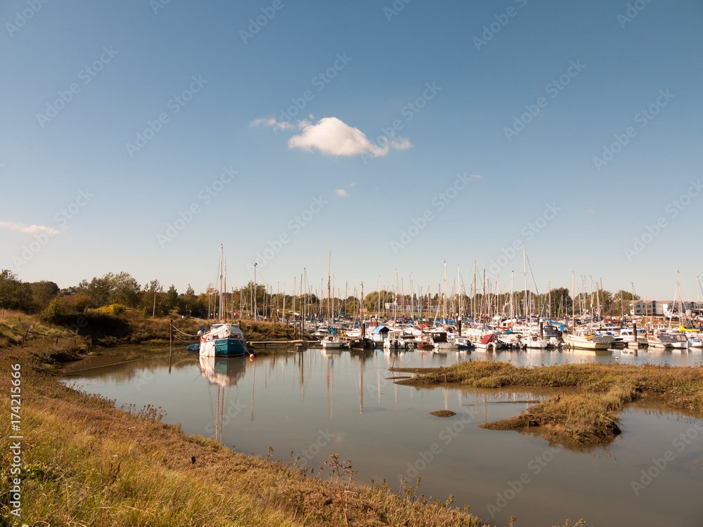 landscape view scene of boats moored in dock marina harbour