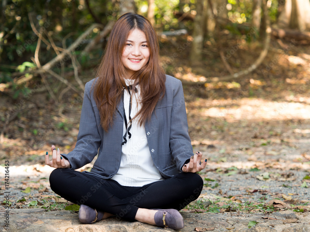 Young asian businesswoman yoga in forest, relaxing for working meditation, business lifestyle and wellbeing concept Young asian businesswoman yoga in forest, relaxing for working meditation, business lifestyle and wellbeing concept