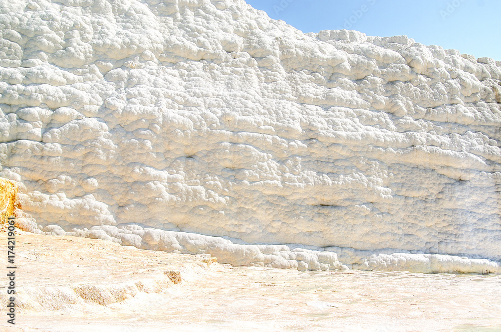 White walls and floor of terraces formed from travertine in Pamukkale, Turkey. White walls and floor of terraces formed from travertine in Pamukkale, Turkey.