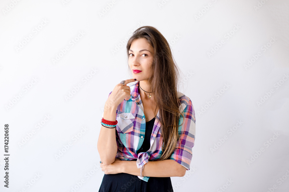 Fototapeta premium Thoughtful and smiling young woman