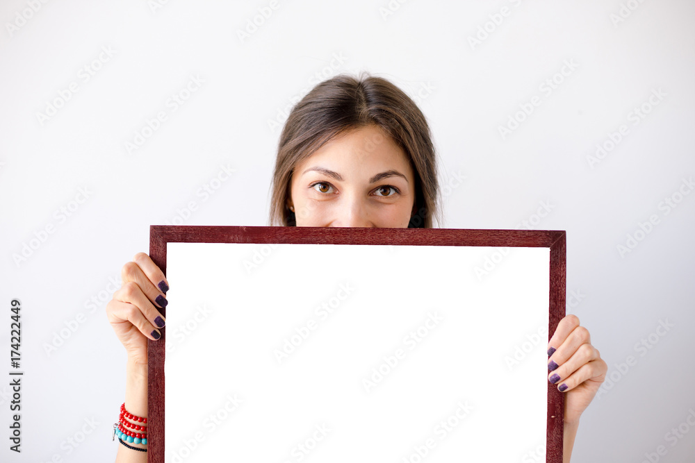 Girl smiling showing blank display Girl smiling showing blank display