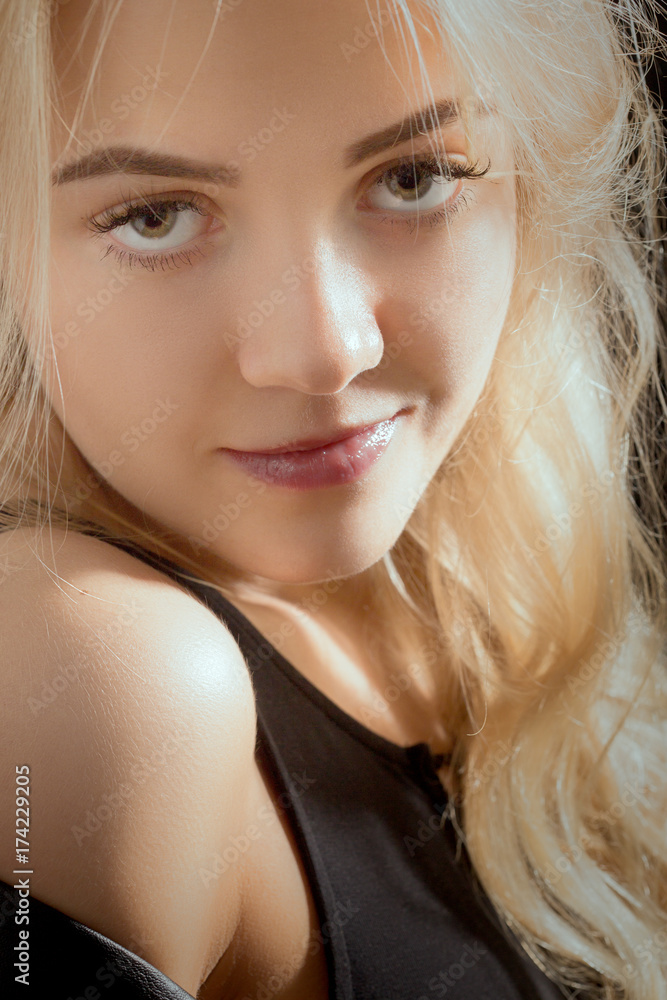 beautiful young blond woman looking at camera smiling beautiful young blond woman looking at camera smiling