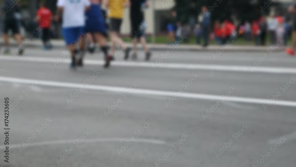 Group of people running in a marathon Group of people running in a marathon