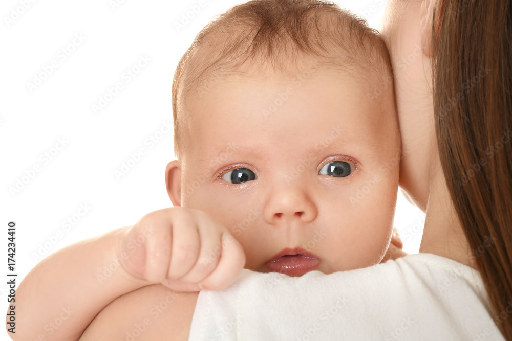 Mother holding cute newborn on white background, closeup