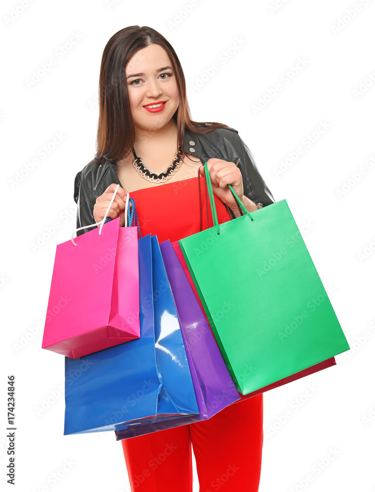 Beautiful stylish overweight woman with shopping bags on white background Beautiful stylish overweight woman with shopping bags on white background