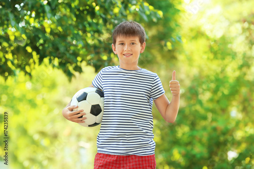 Cute boy with soccer ball i...