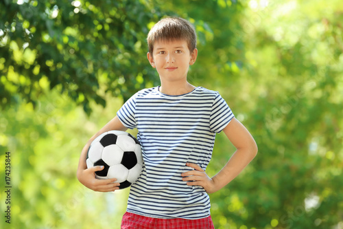 Cute boy with soccer ball i...