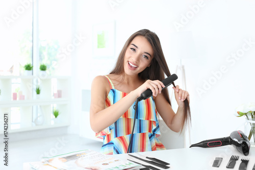 Young female blogger stylin...
