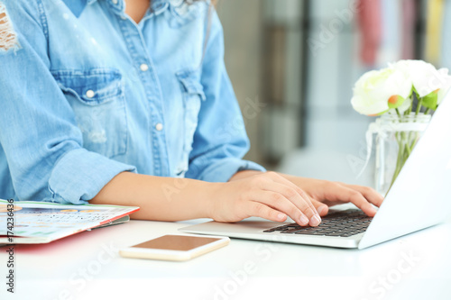 Female blogger with laptop ...