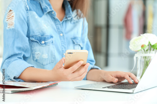 Female blogger with laptop ...