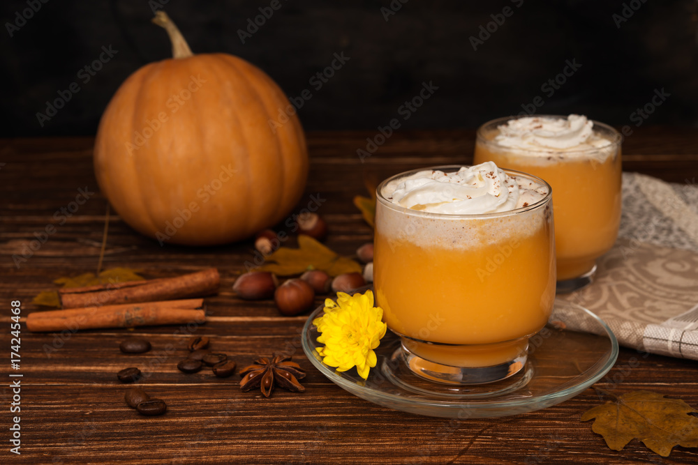 Pumpkin smoothie on wooden rustic background Pumpkin smoothie on wooden rustic background