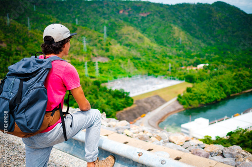 Man traveler traveling walking with backpack at the jungle on holiday at weekend on background nature view