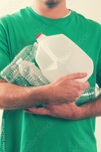 Man holding recycling material