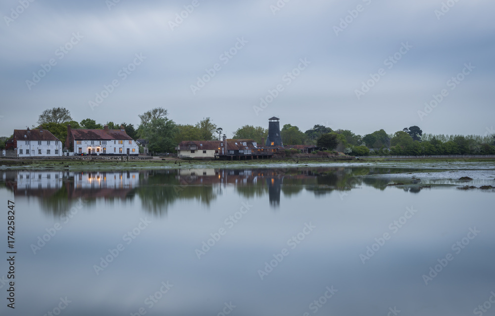 Langstone Mill in Hampshire at twilight.