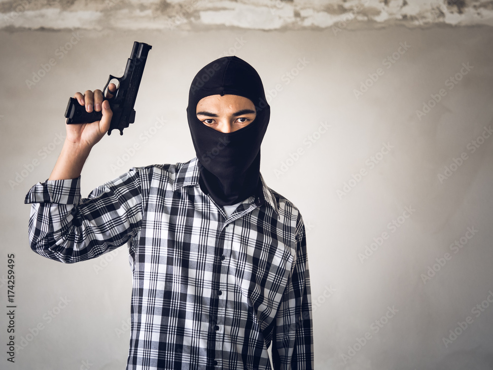 Portrait terrorist man holding gun, carbine and machine gun Portrait terrorist man holding gun, carbine and machine gun