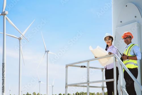 Engineers inspect the operation of wind turbines.